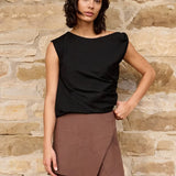 Sleeveless top w/twist shoulder
